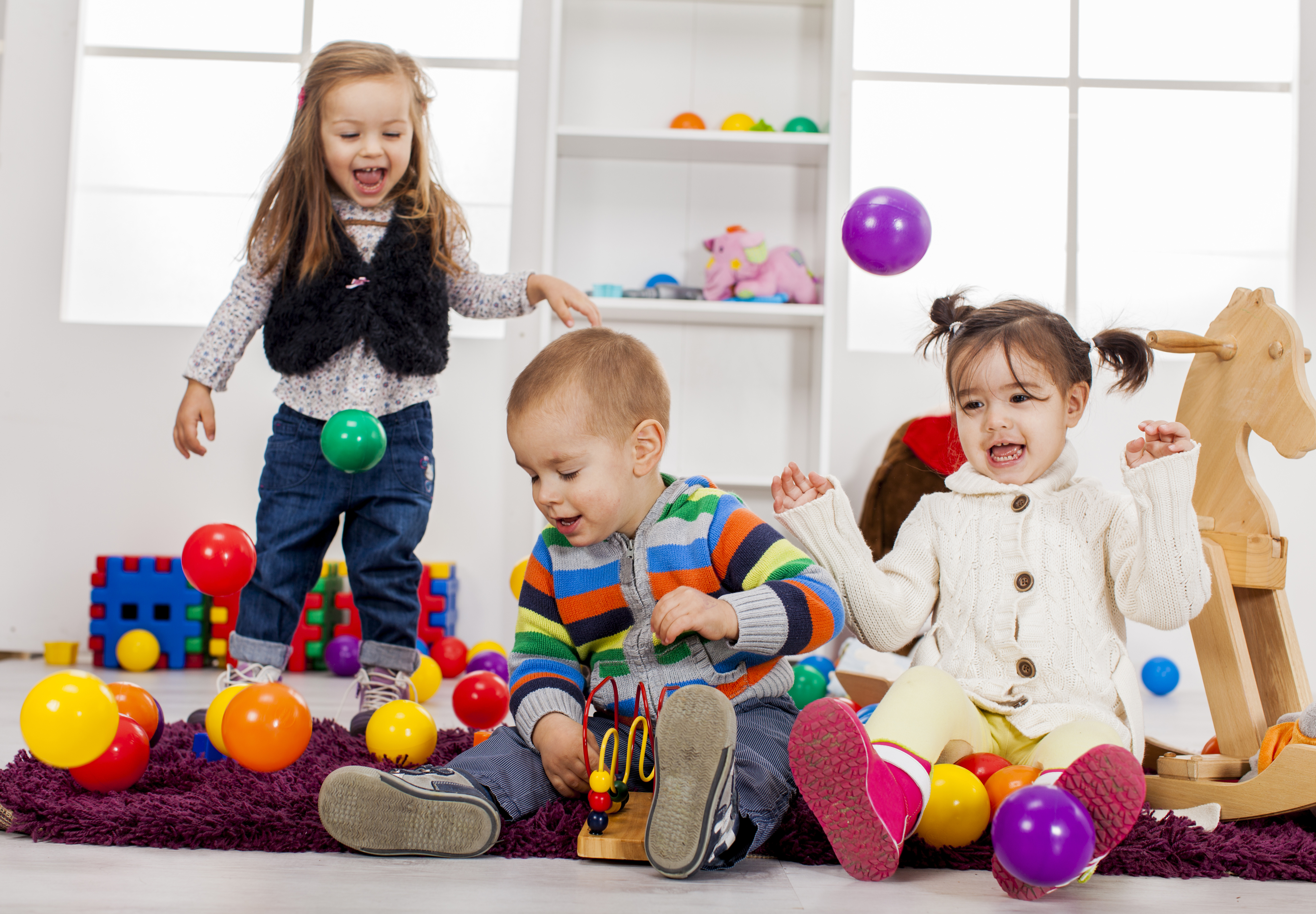 sf-children-playing-in-playroom-with-balls.jpg