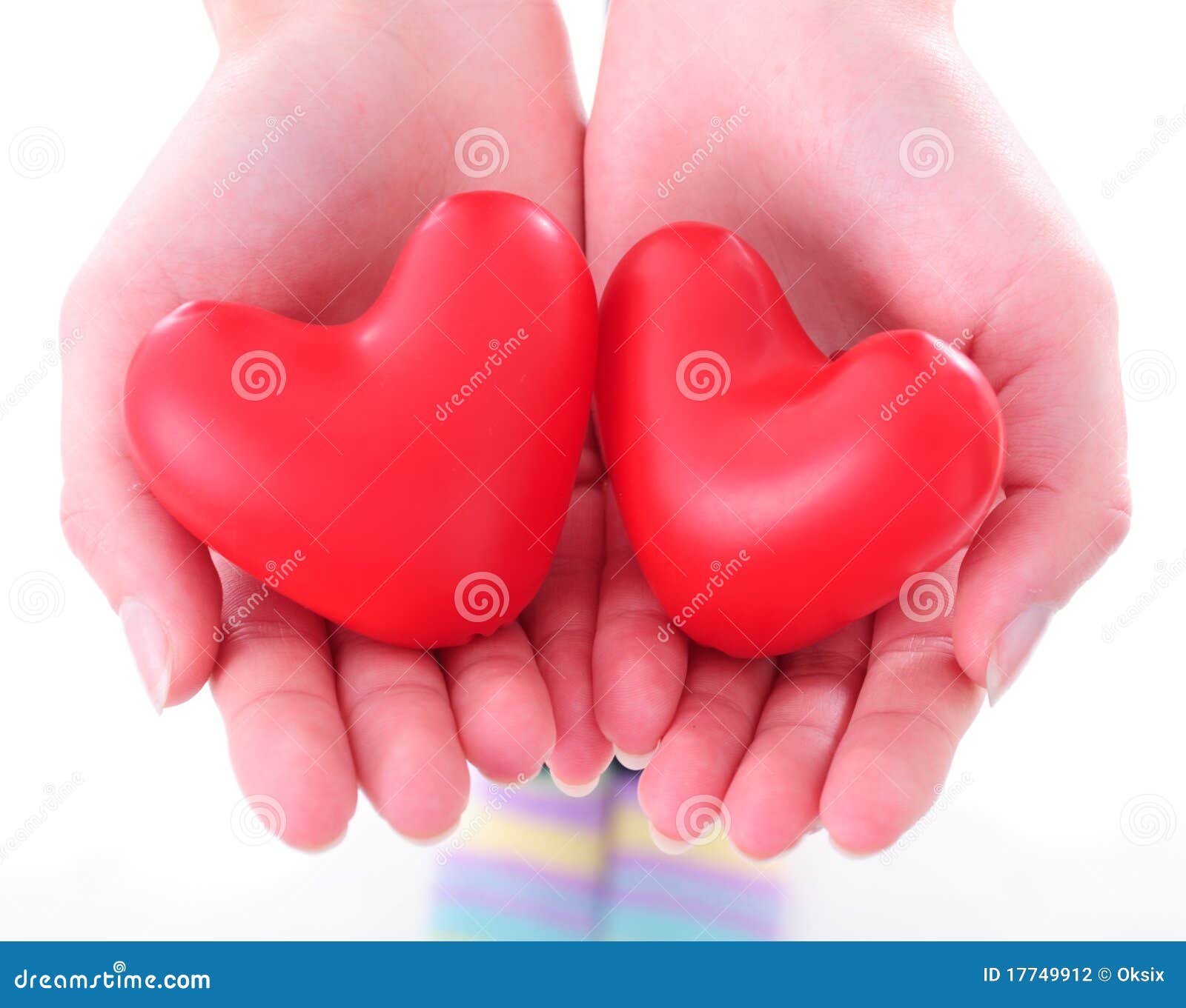 two-hearts-female-hands-17749912.jpg