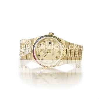 rolex_an_unusual_18k_gold_tonneau-shaped_wristwatch_with_day_date_swee_d5493343h_zps29d6e3c6.jpg